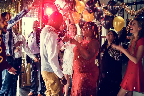 Adults enjoying premium bowling lanes and cocktails